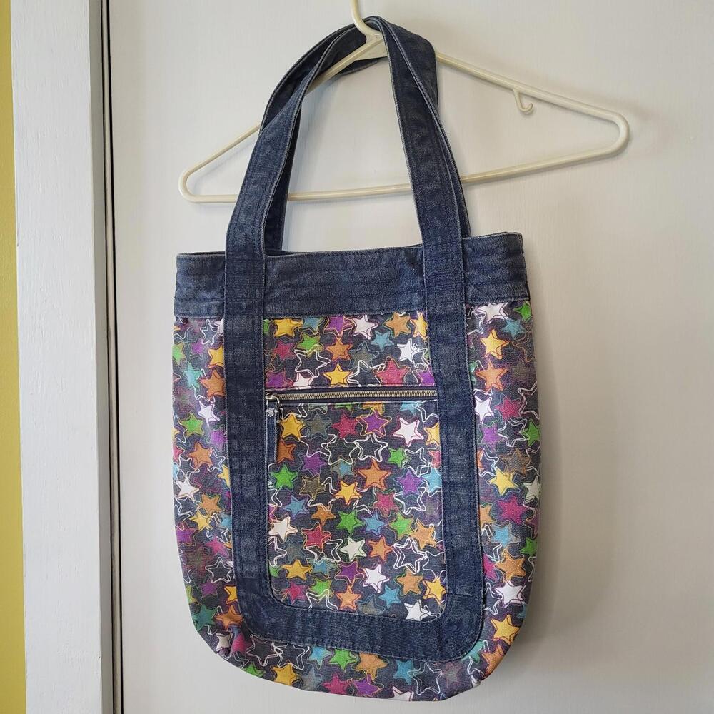 Vtg denim blue tote bag with multicolor star pattern W 4.5" L 15" zipper closure